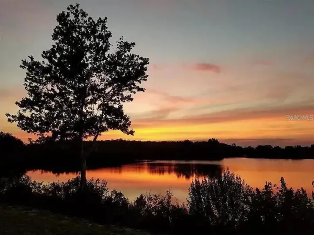 a view of lake from sunset
