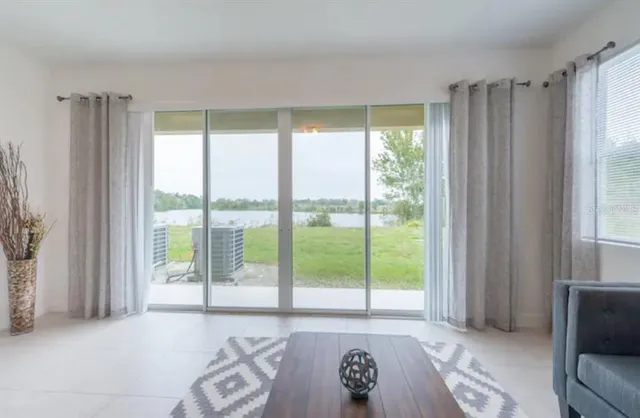 a view of room with window and furniture