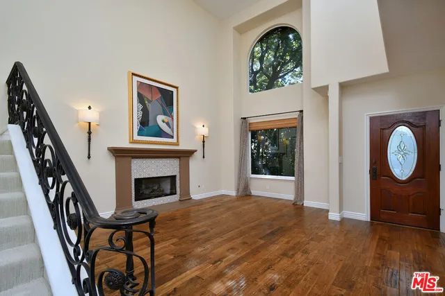 a view of a livingroom with furniture and staircase