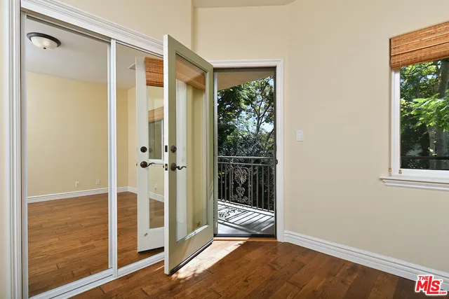 a bathroom with a bathtub a mirror and sink