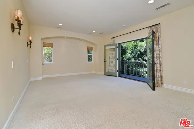 a balcony with an outdoor space