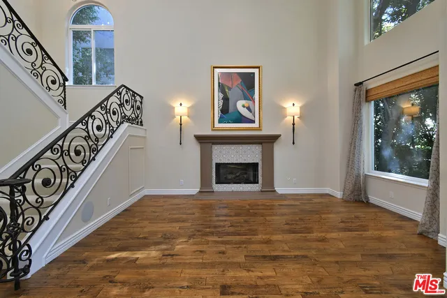 a view of an entryway with wooden floor