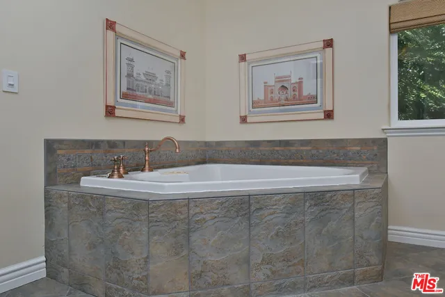 a view of staircase with white walls and white door