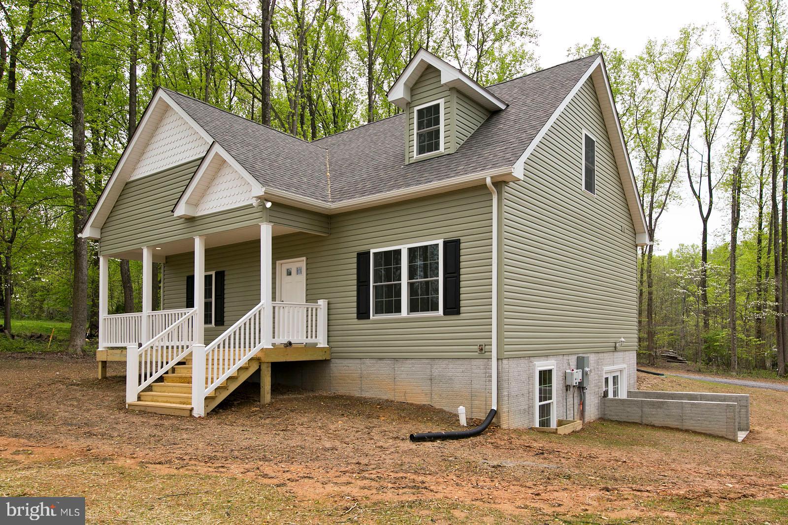 320 Pine Grove Road Bluemont, VA 20135 - Photo 28 of 28 a view of a house with a yard and large tree