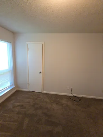 an empty room with a empty space and window