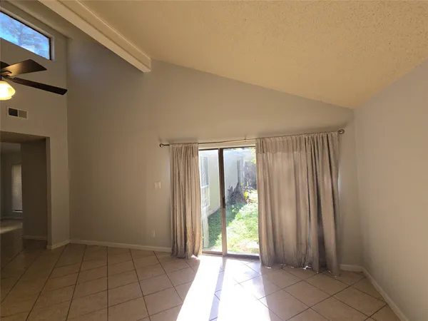 a view of an empty room and window