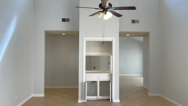 a view of an empty room with a bathroom