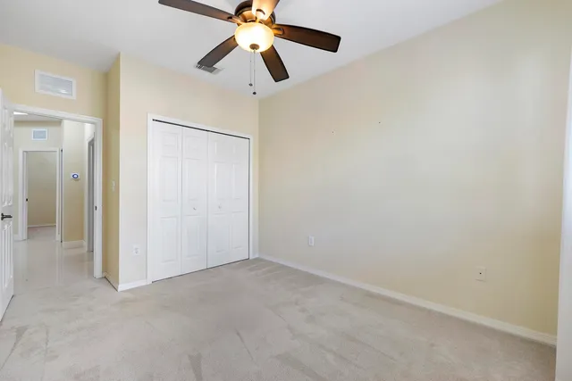 wooden floor in a hall with a window