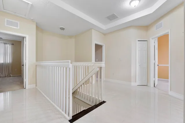 en view interior of a house with wooden floor and windows