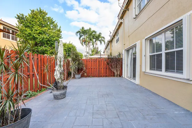 a view of front door and small yard