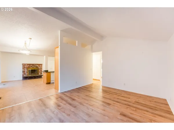 a view of a kitchen with wooden floor