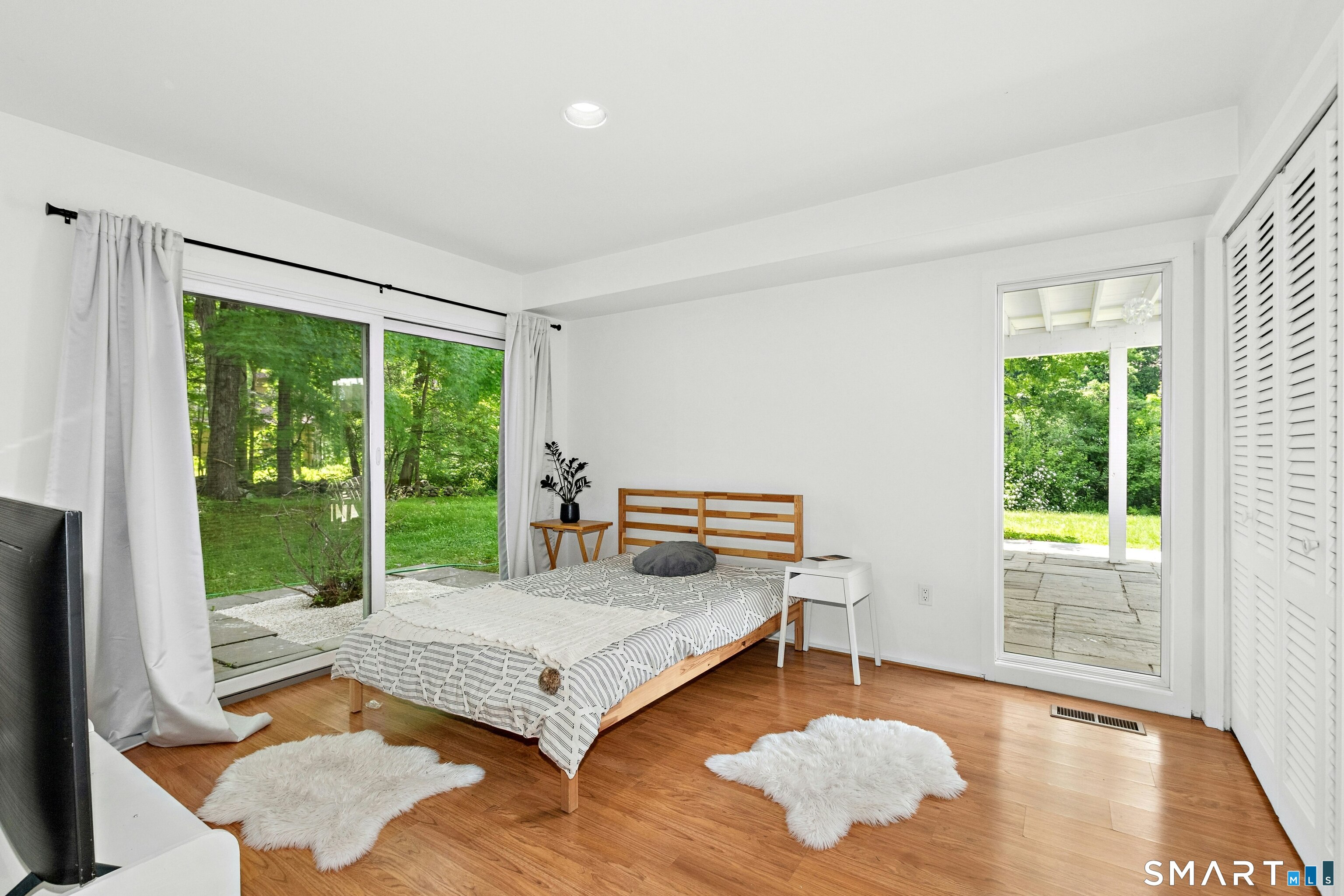 38 Old Redding Road Weston, CT 06883 - Photo 27 of 40 This Bedroom has wonderful sunlight and views outside.