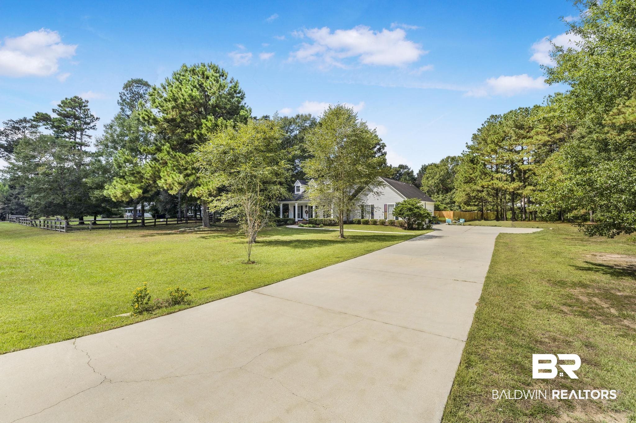 10603 Old Stage Road Stockton, AL 36579 - Photo 8 of 34 View of home's community with driveway and view of wooded area