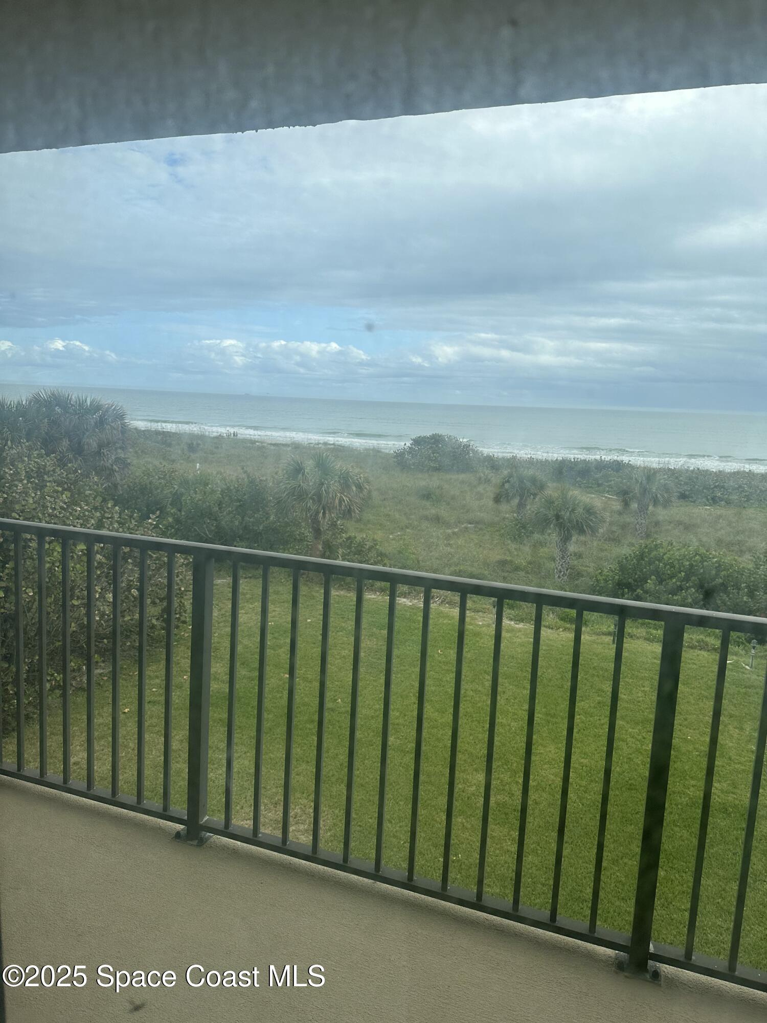 3170 North Atlantic Avenue, Unit 307 Cocoa Beach, FL 32931 - Photo 1 of 12 a view of balcony with outdoor space