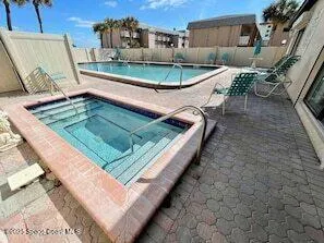 a view of a balcony with chairs