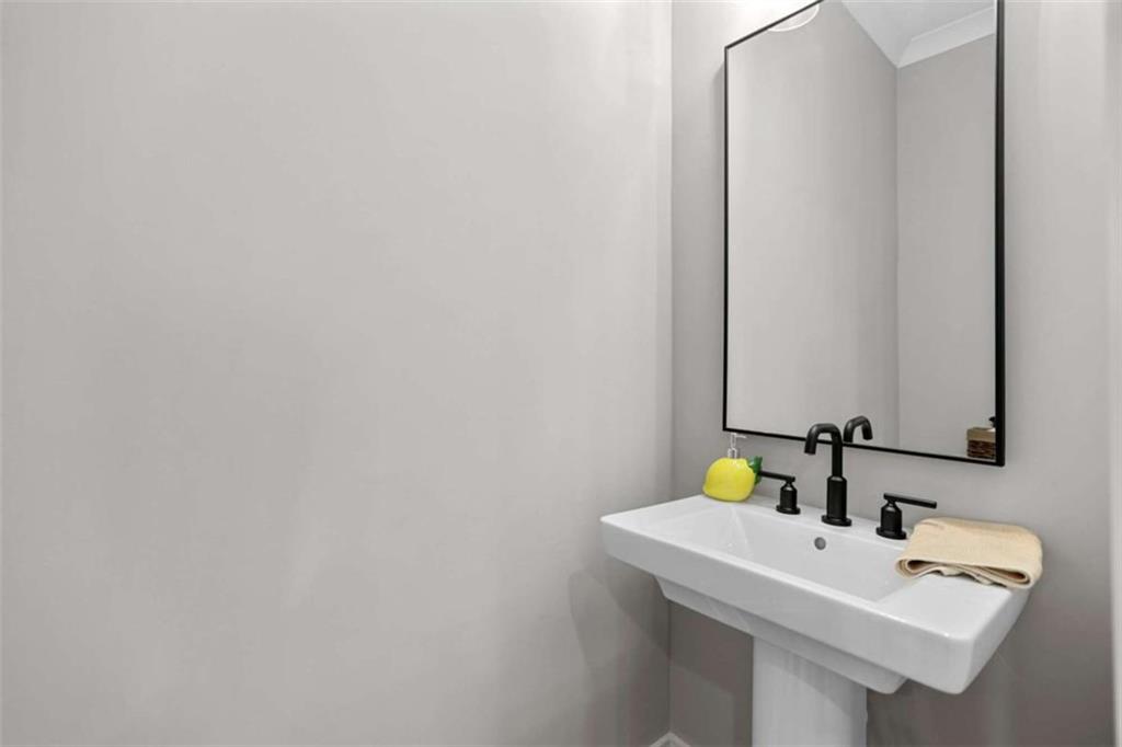 4466 Lemon Street Acworth, GA 30101 - Photo 24 of 65 a bathroom with a sink and a mirror
