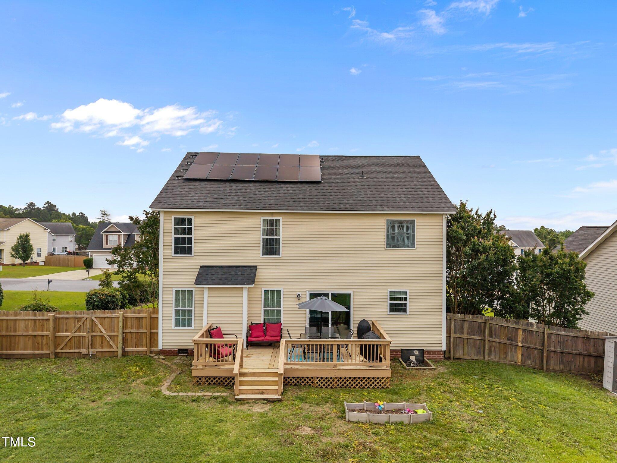 76 Haywood Street Spring Lake, NC 28390 - Photo 22 of 28 a view of a house with a yard and sitting area