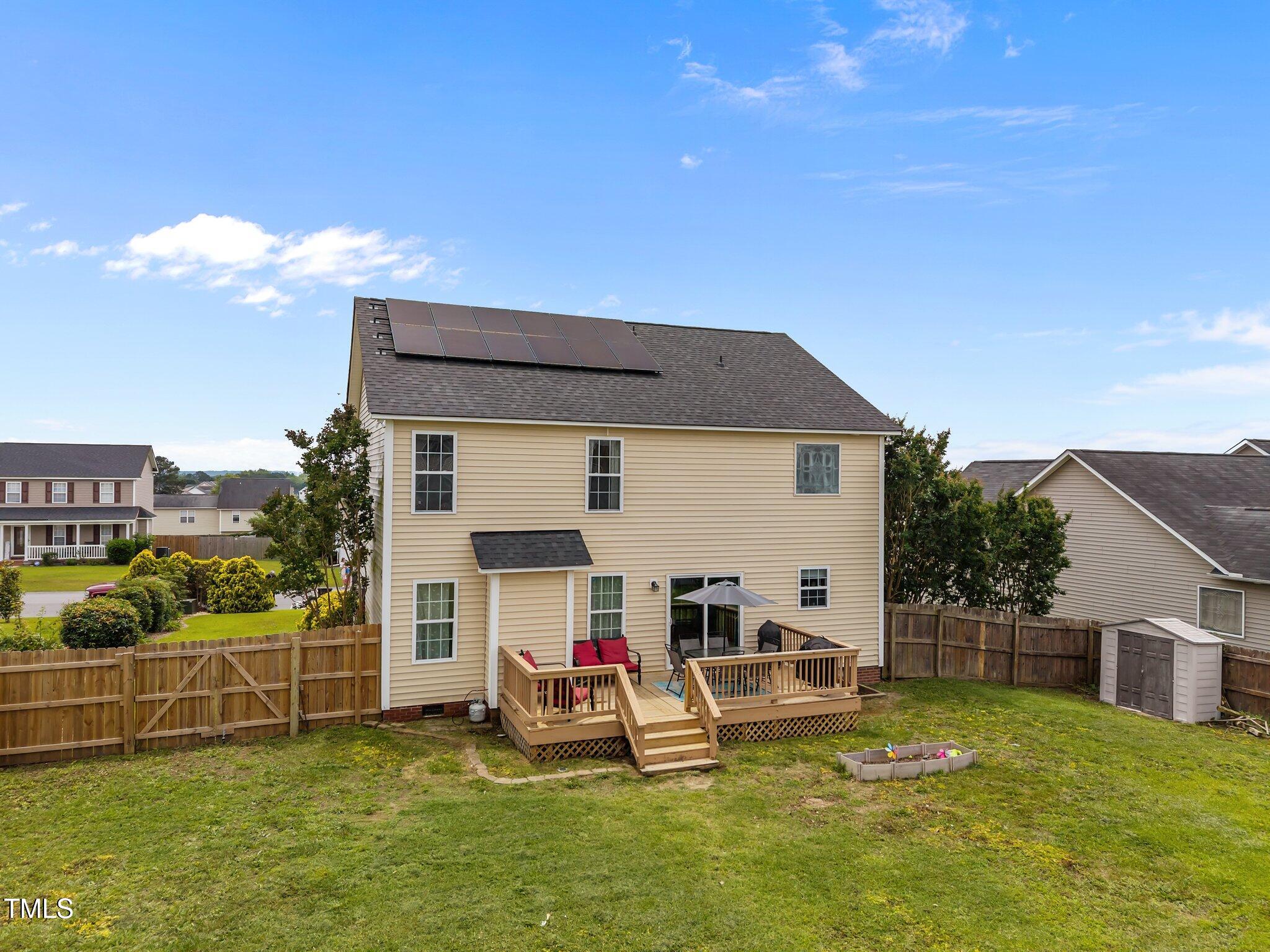 76 Haywood Street Spring Lake, NC 28390 - Photo 23 of 28 a view of a house with backyard swimming pool and sitting area