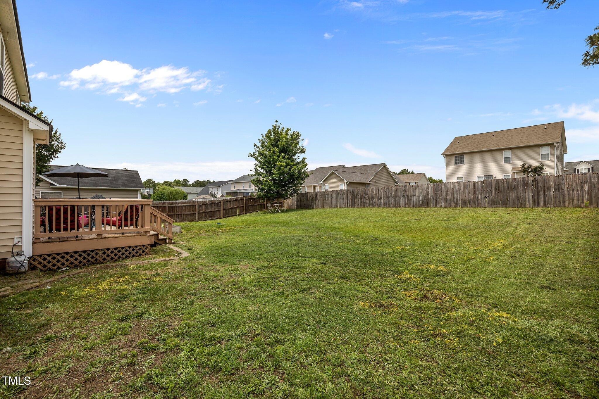 76 Haywood Street Spring Lake, NC 28390 - Photo 24 of 28 a view of a house with a yard