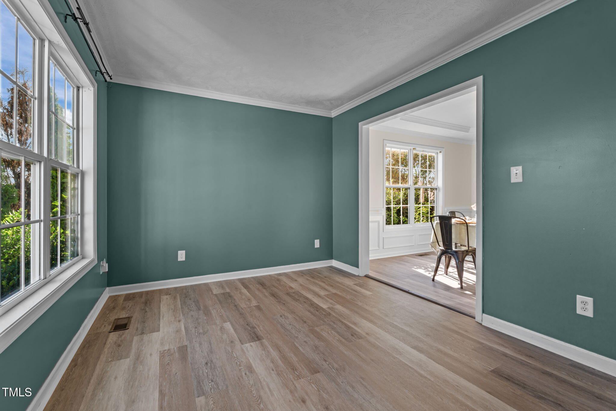 76 Haywood Street Spring Lake, NC 28390 - Photo 4 of 28 a view of an empty room with glass door and balcony