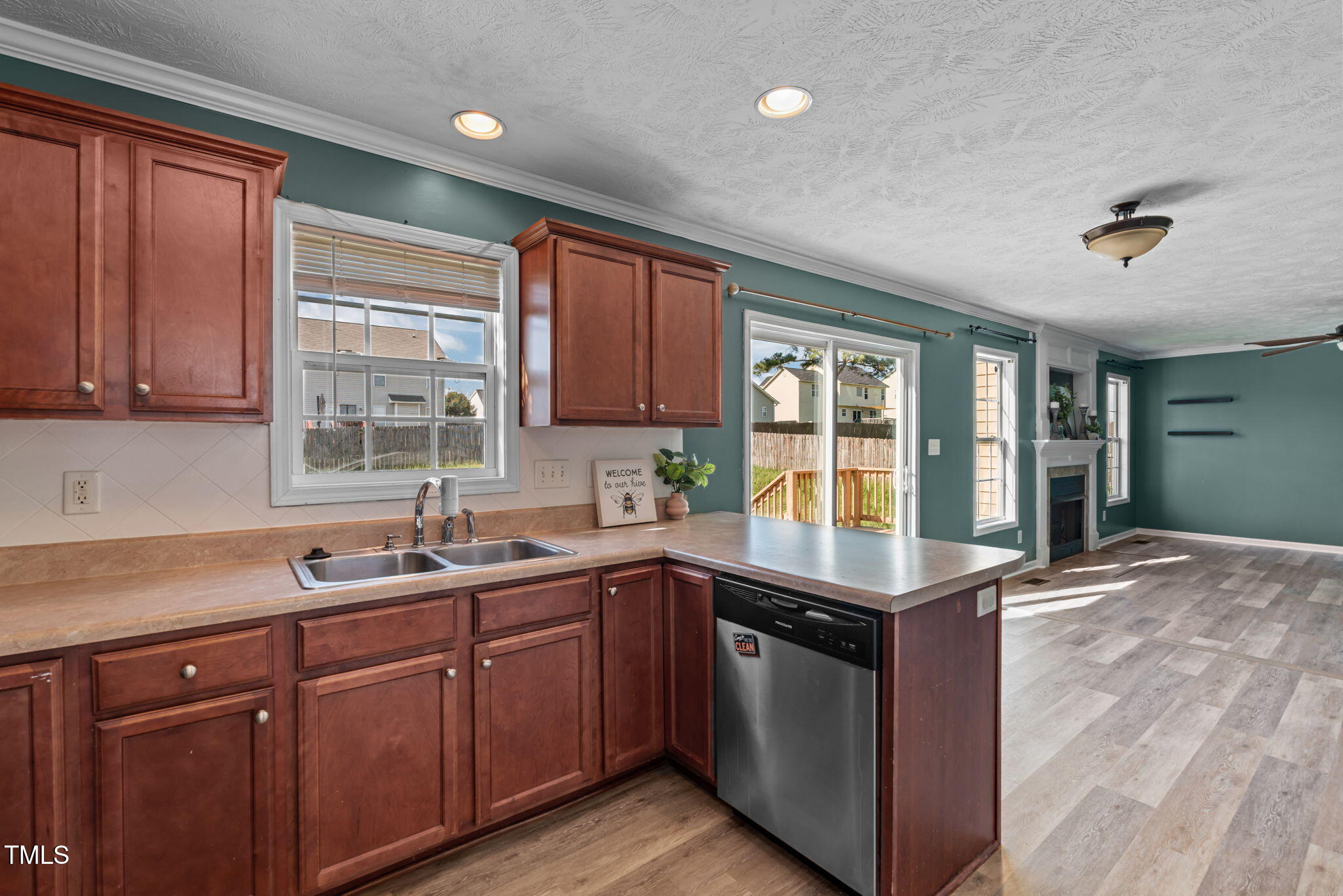 76 Haywood Street Spring Lake, NC 28390 - Photo 8 of 28 a kitchen with kitchen island granite countertop a sink stainless steel appliances and cabinets