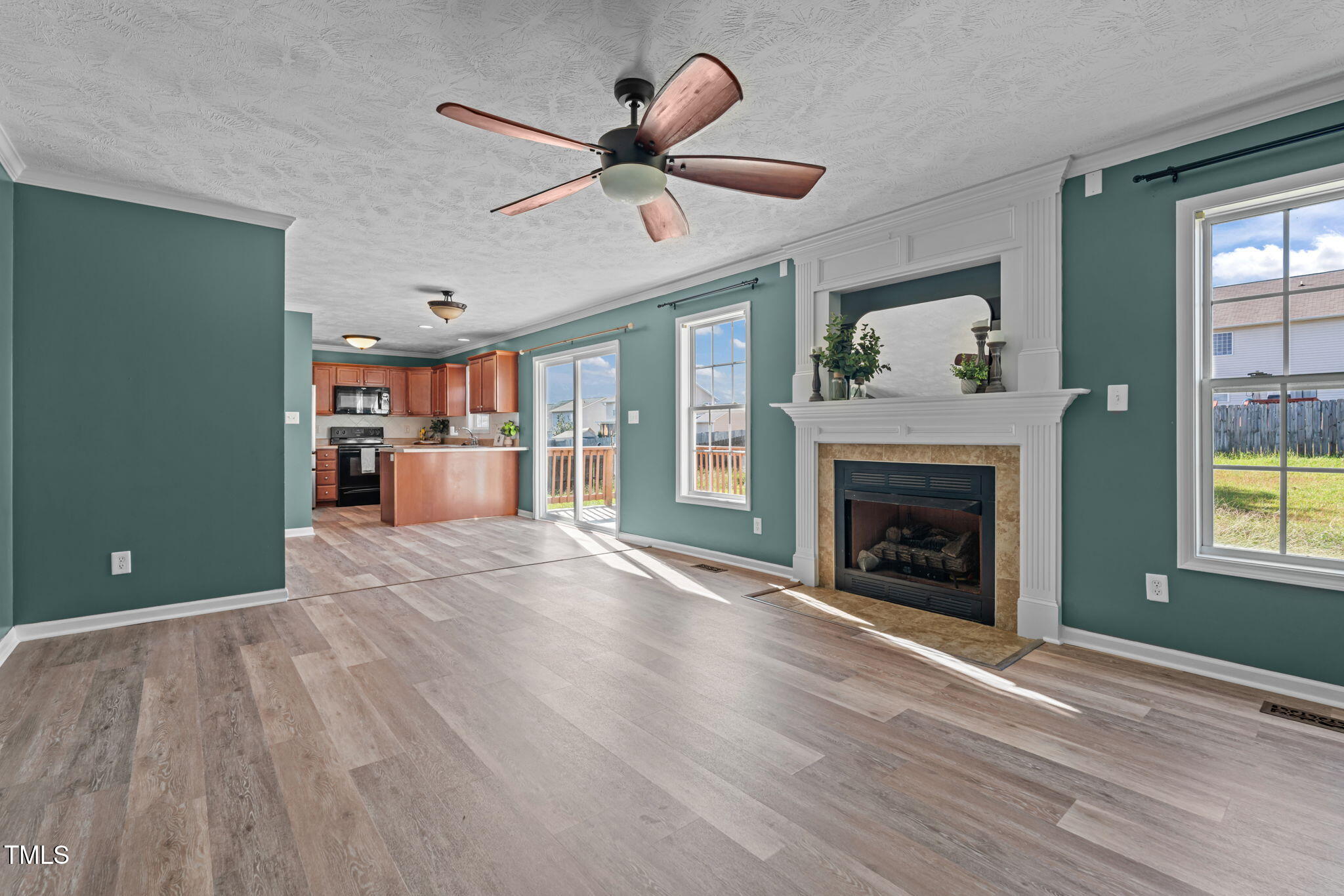 76 Haywood Street Spring Lake, NC 28390 - Photo 10 of 28 a view of a livingroom with a fireplace and window