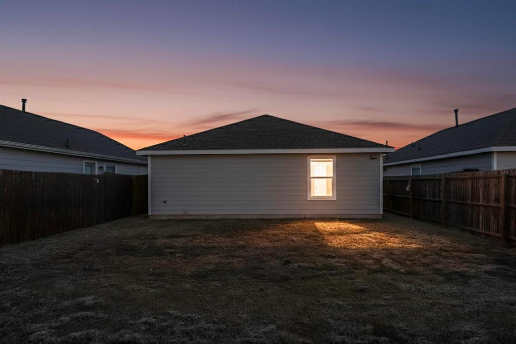 5516 McClelland Street Forney, TX 75126 - Photo 30 of 36 Back of property at dusk with a fenced backyard