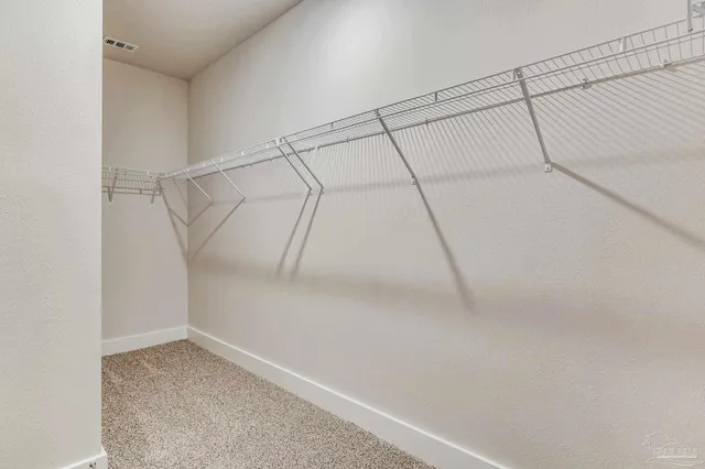 a view of a house with a swimming pool and a yard