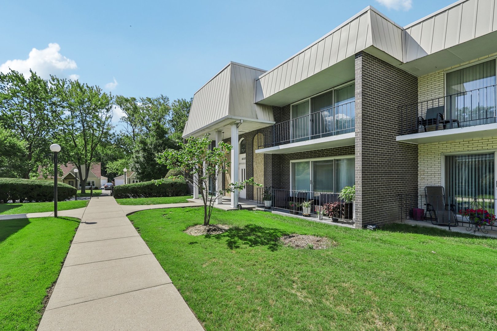 a view of a house with a yard porch and sitting area