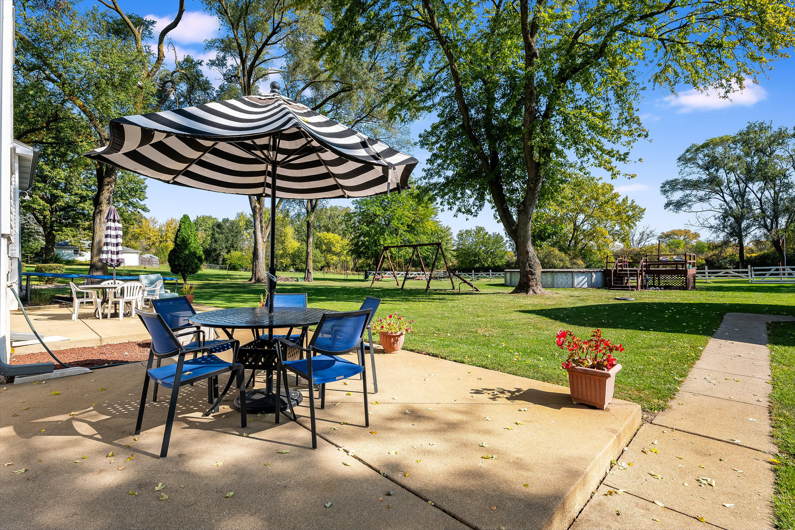 4S365 Meadow Road Naperville, IL 60563 - Photo 20 of 32 a view of a table and chairs in the garden