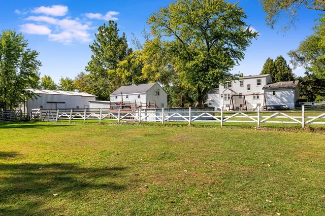 a view of a swimming pool with outdoor seating