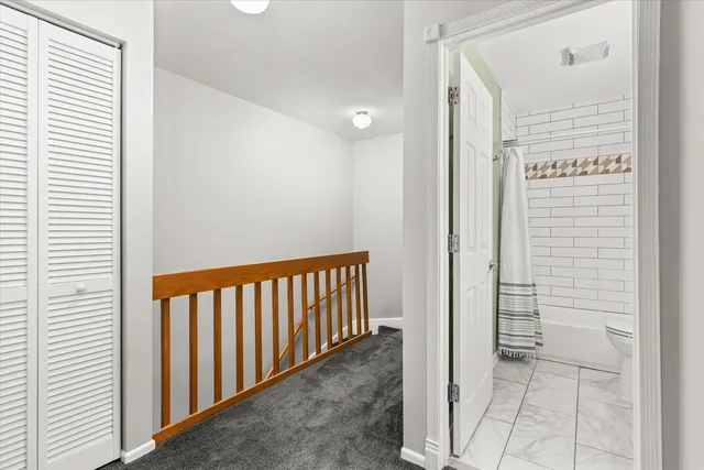 a bathroom with a bathtub and toilet