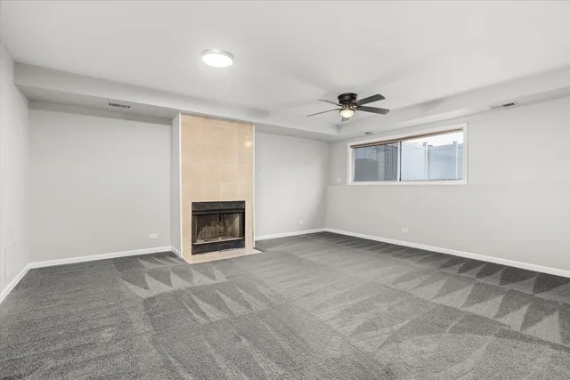 a view of an empty room with a fireplace