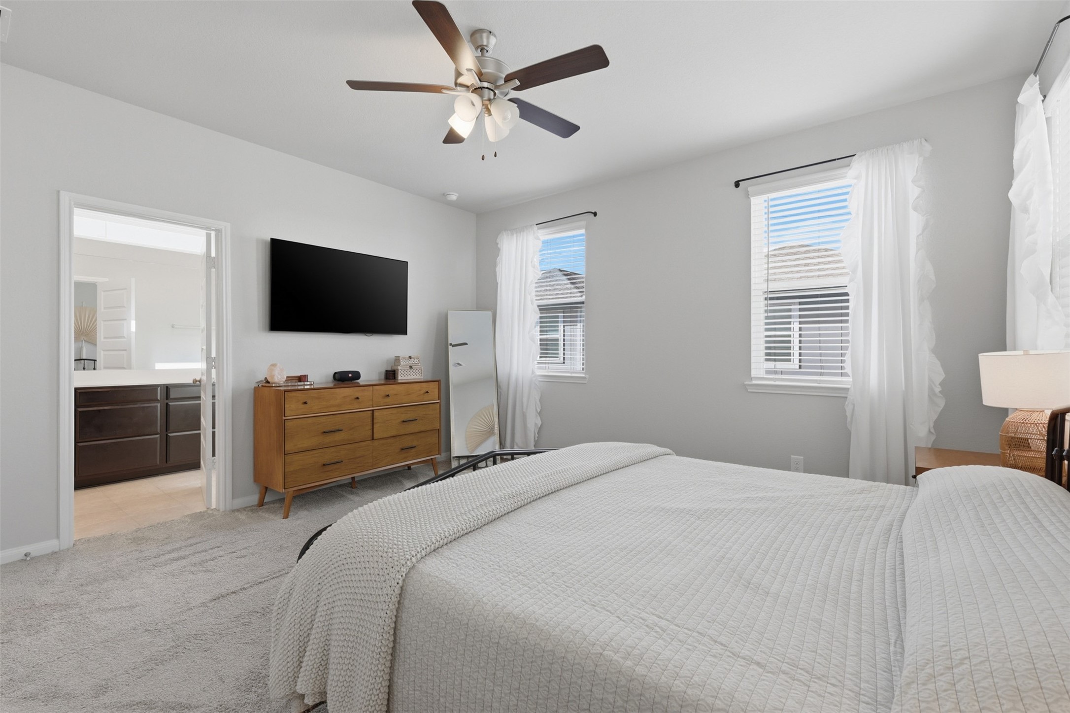 5415 Cuerta Street Houston, TX 77023 - Photo 15 of 25 a bedroom with a bed a window and a television