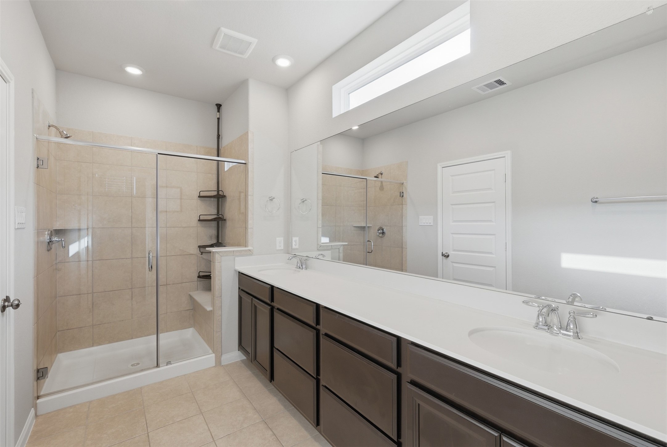 5415 Cuerta Street Houston, TX 77023 - Photo 16 of 25 a spacious bathroom with a shower sink and mirror