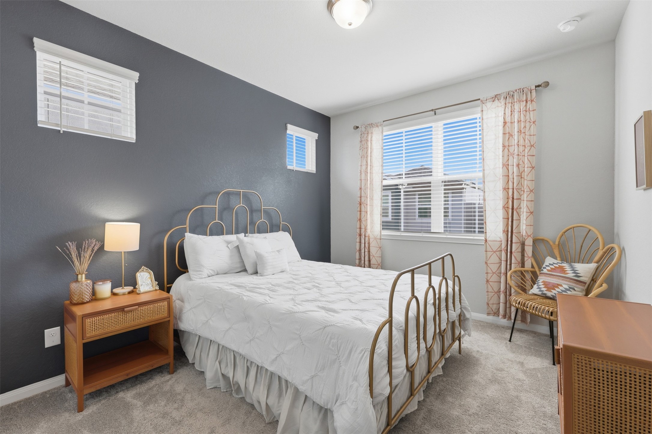 5415 Cuerta Street Houston, TX 77023 - Photo 19 of 25 a bedroom with a bed chairs and a window