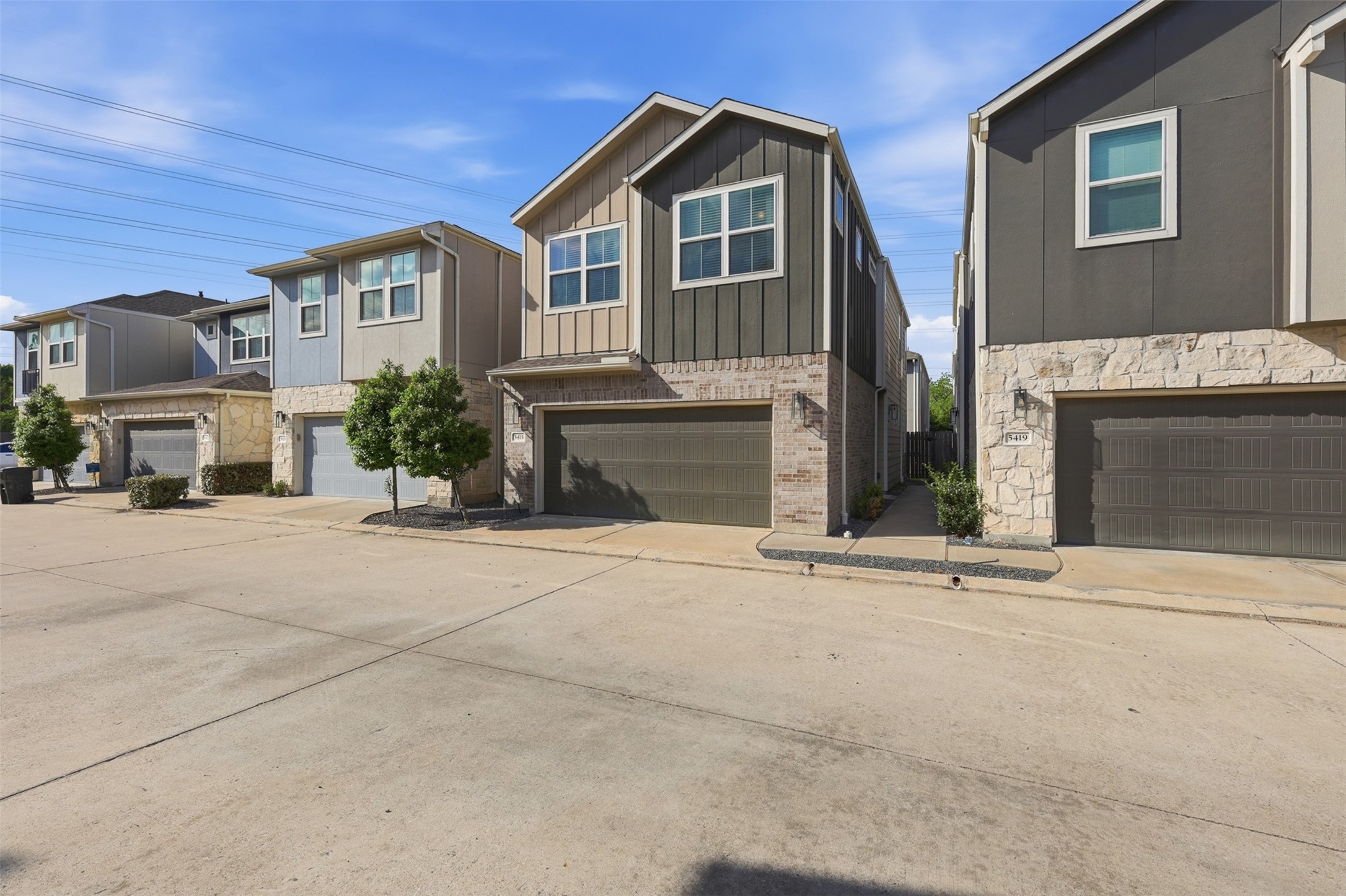 5415 Cuerta Street Houston, TX 77023 - Photo 2 of 25 a front view of a house with a yard and garage