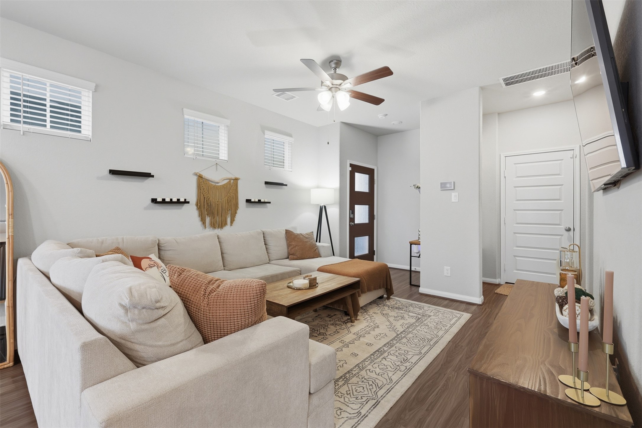 5415 Cuerta Street Houston, TX 77023 - Photo 6 of 25 a living room with furniture and a chandelier