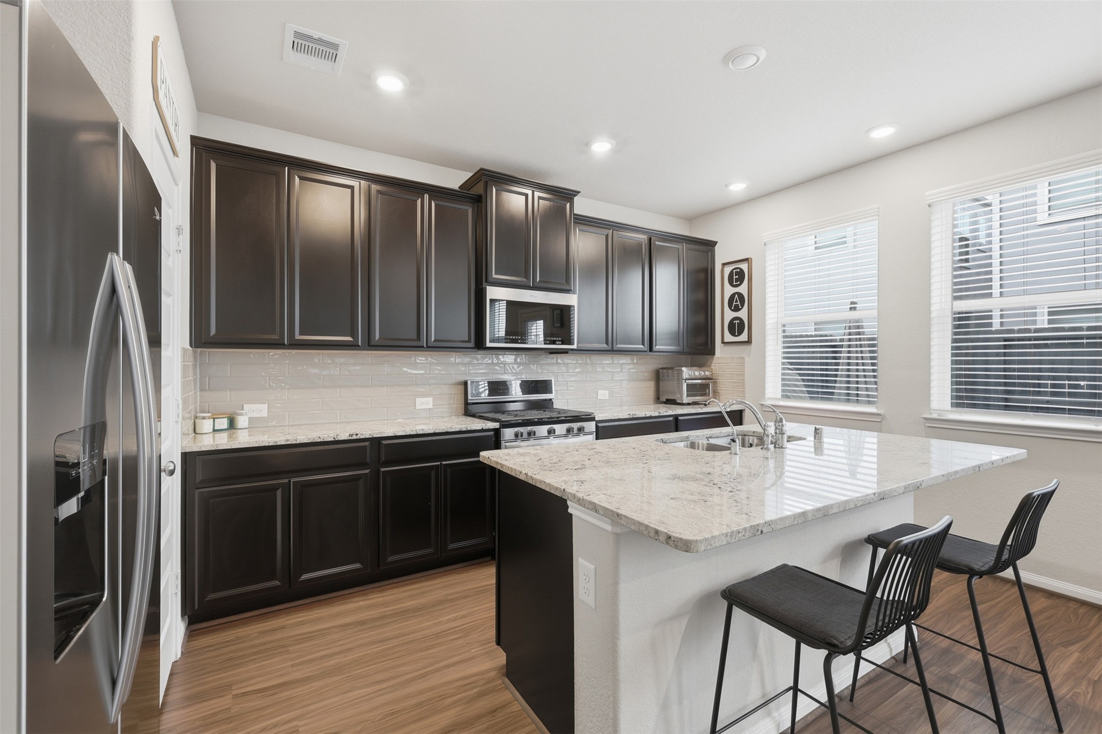 5415 Cuerta Street Houston, TX 77023 - Photo 9 of 25 a kitchen with stainless steel appliances granite countertop a stove refrigerator sink and cabinets