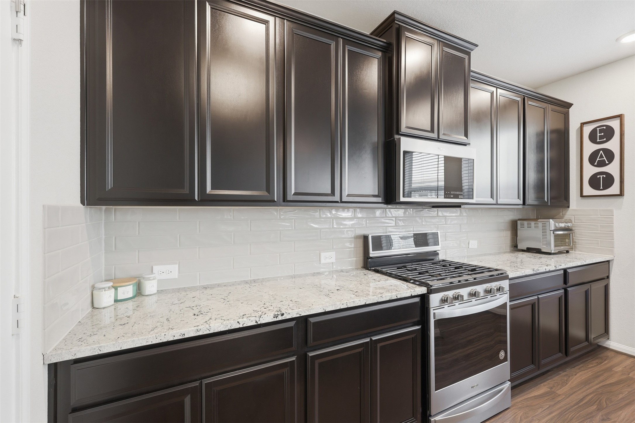 5415 Cuerta Street Houston, TX 77023 - Photo 10 of 25 a kitchen with stainless steel appliances granite countertop a sink stove oven and cabinets