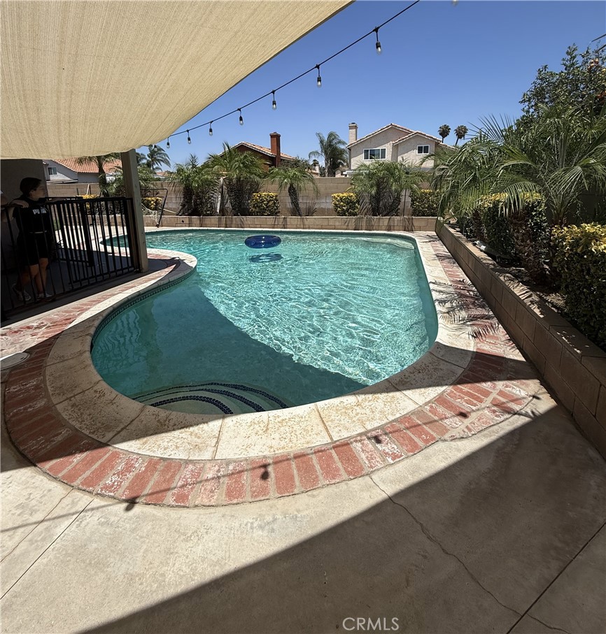 3165 Weatherby Drive Riverside, CA 92503 - Photo 25 of 30 a view of a swimming pool with a yard
