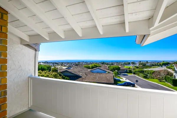a view of a balcony with city view