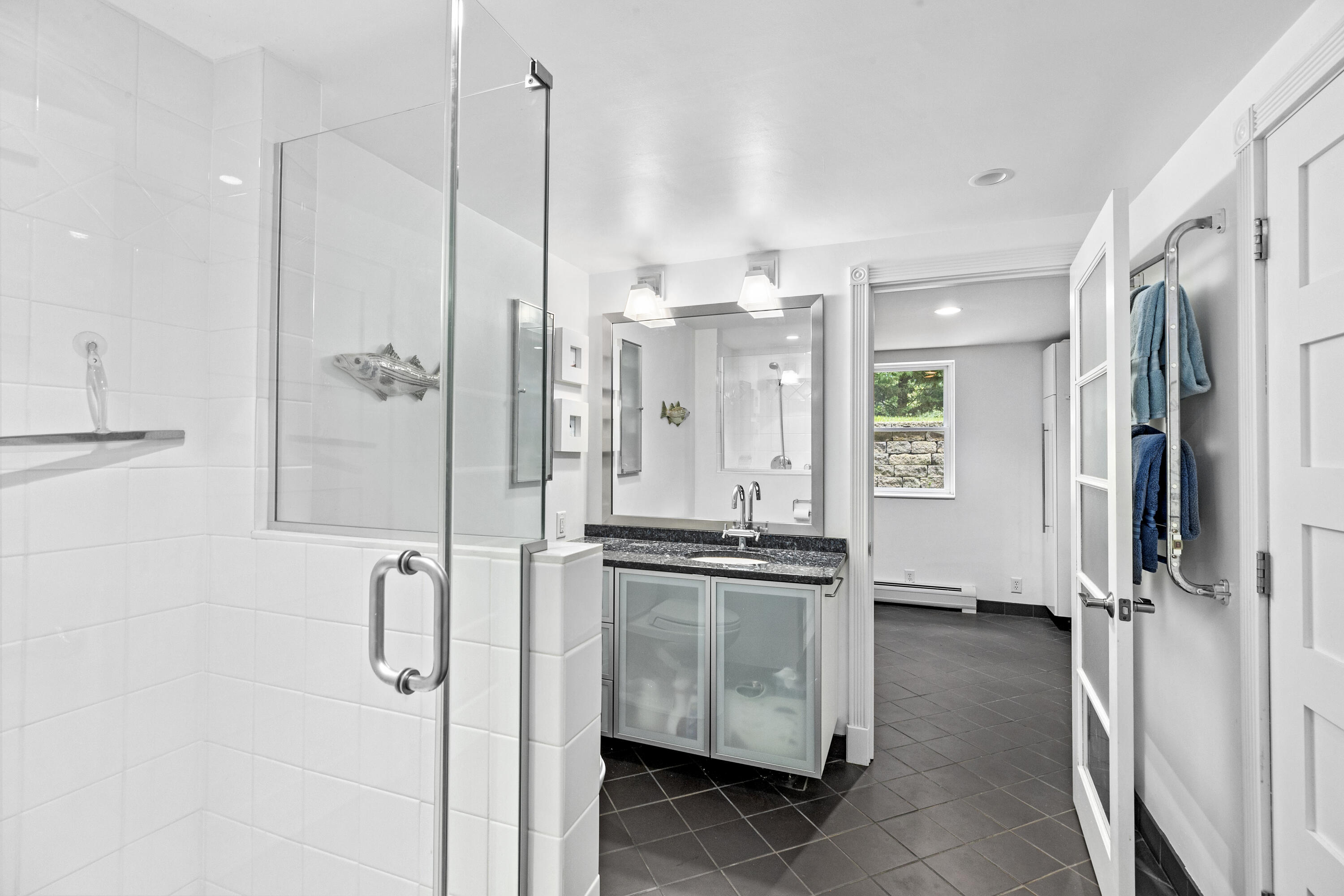 119 Cottonwood Road Harwich, MA 02645 - Photo 20 of 30 a bathroom with a granite countertop sink a mirror and a shower