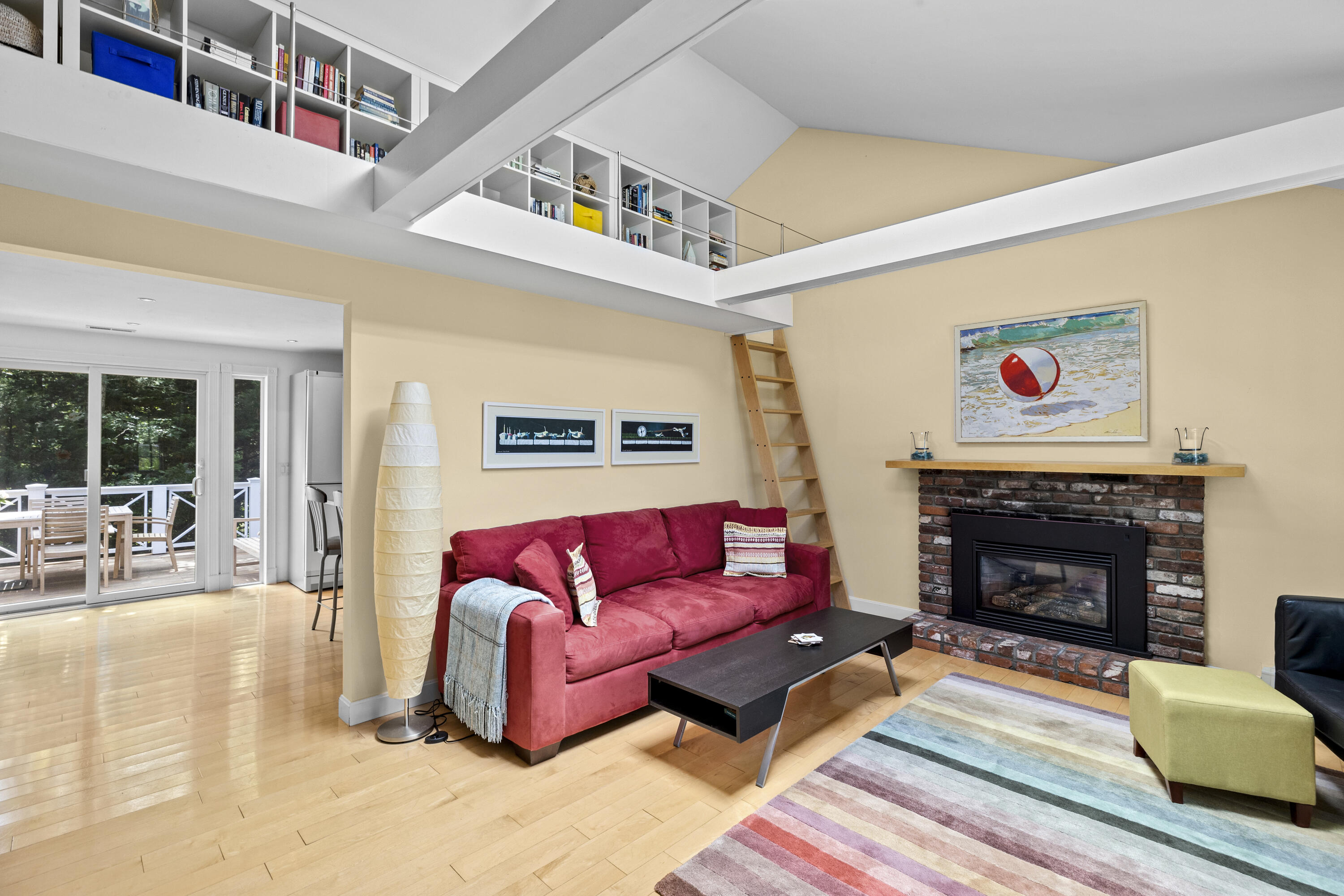 119 Cottonwood Road Harwich, MA 02645 - Photo 2 of 30 a living room with furniture or couch and a fireplace