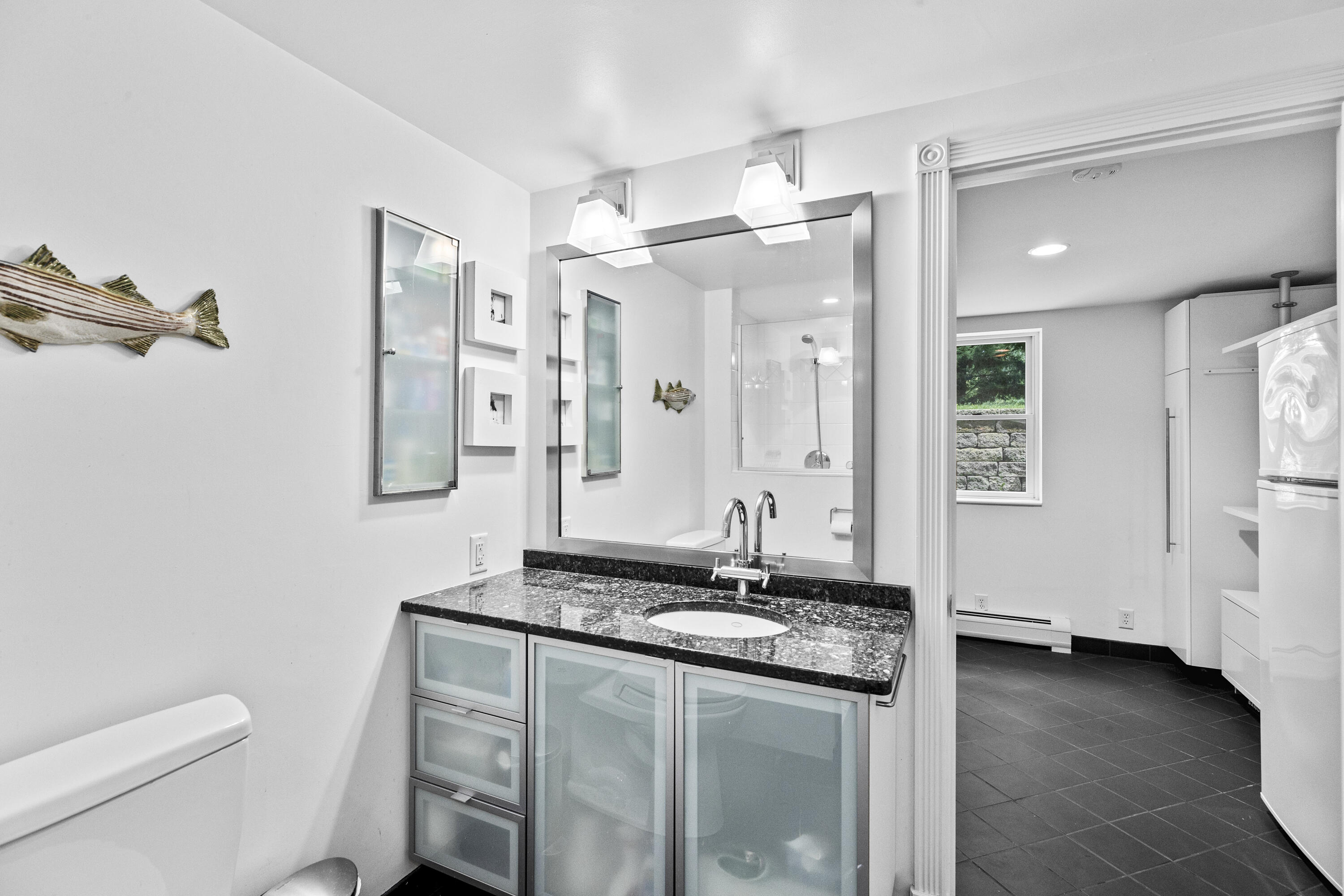 119 Cottonwood Road Harwich, MA 02645 - Photo 21 of 30 a bathroom with a granite countertop sink a toilet a mirror and shower