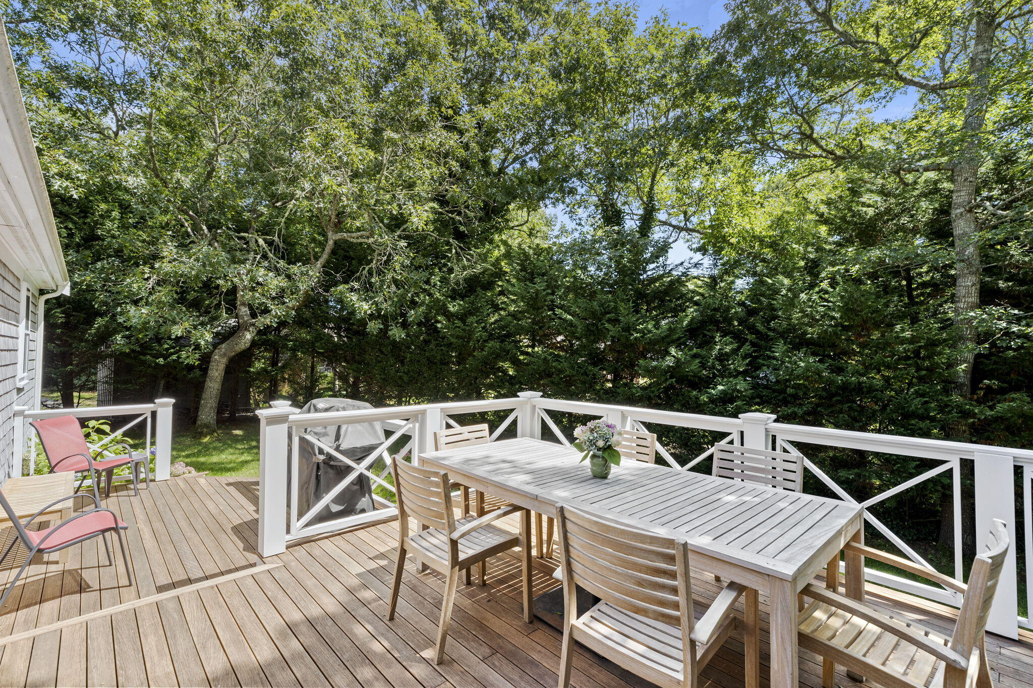 119 Cottonwood Road Harwich, MA 02645 - Photo 25 of 30 a view of backyard with table and chairs and wooden floor