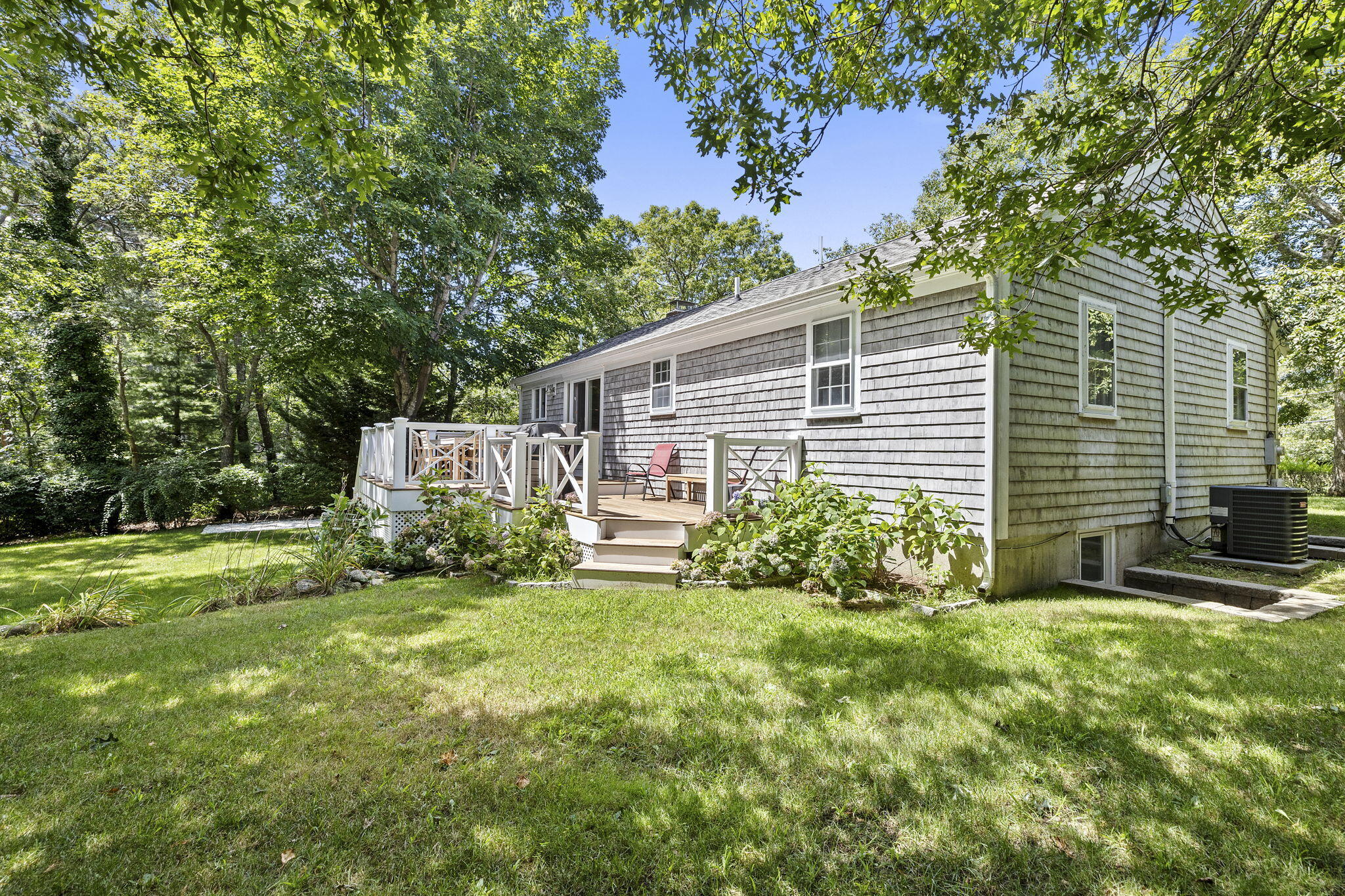 119 Cottonwood Road Harwich, MA 02645 - Photo 27 of 30 a view of a house with a yard and pathway