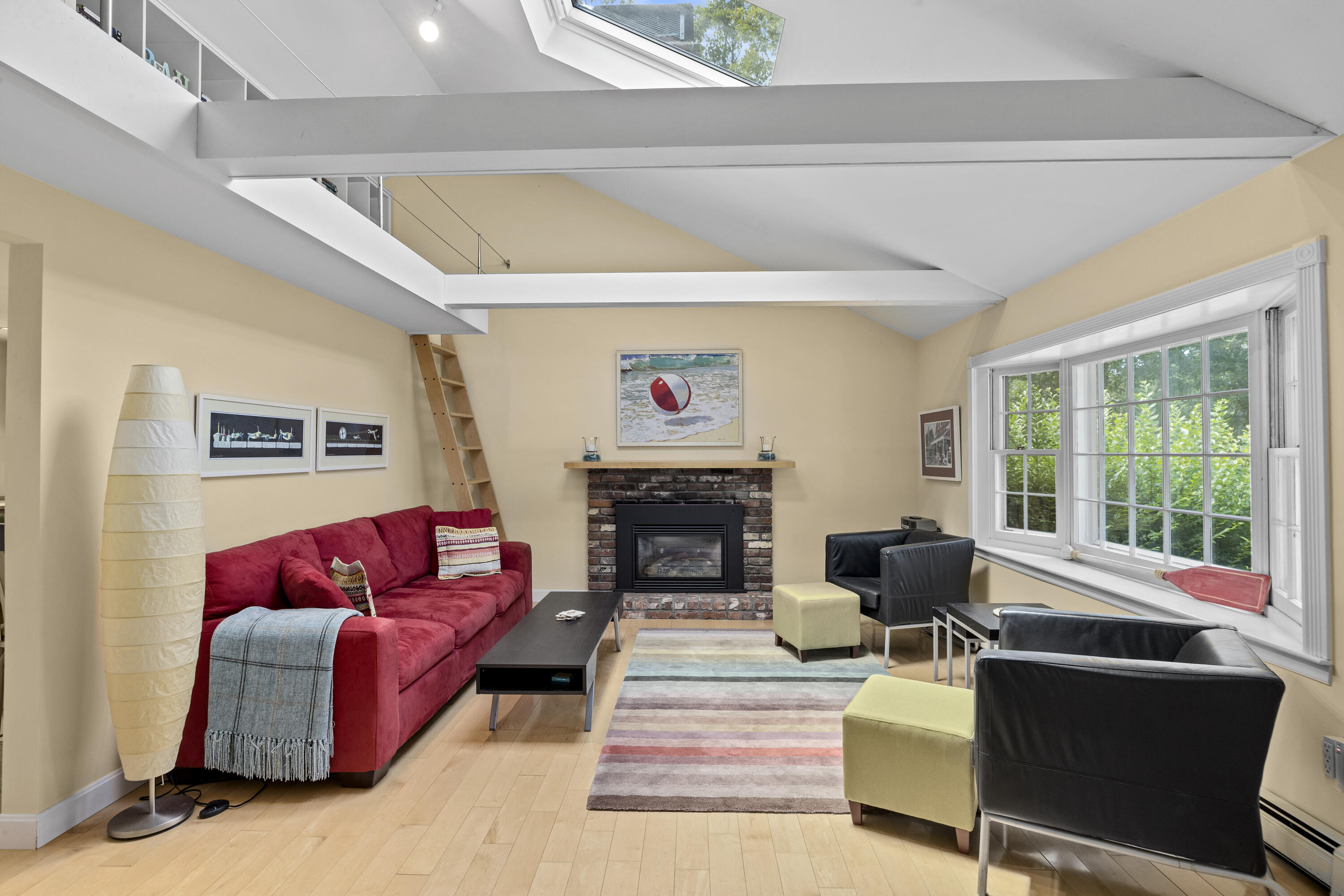 119 Cottonwood Road Harwich, MA 02645 - Photo 3 of 30 a living room with furniture large window and a fireplace