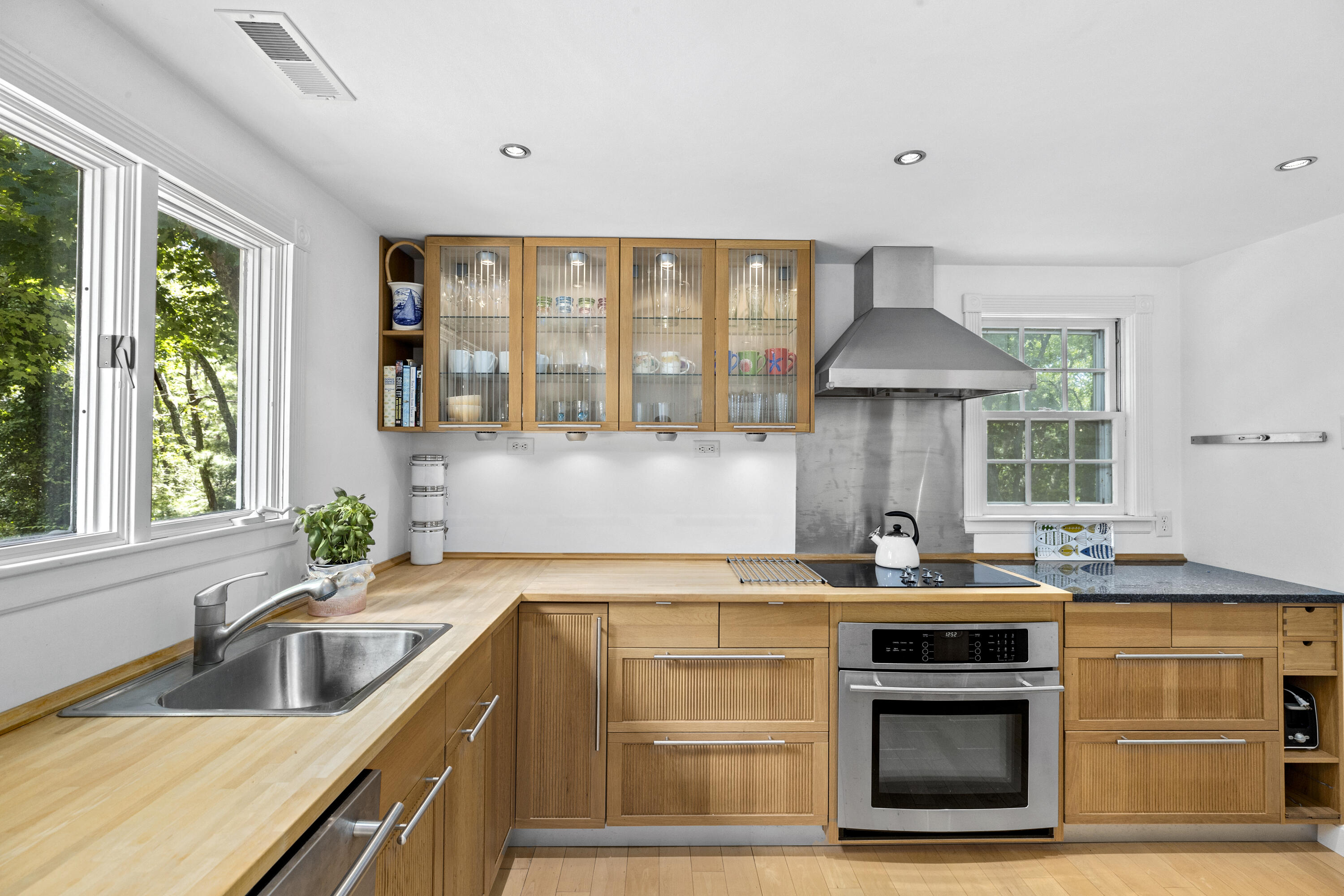 119 Cottonwood Road Harwich, MA 02645 - Photo 8 of 30 a kitchen with a stove and a sink