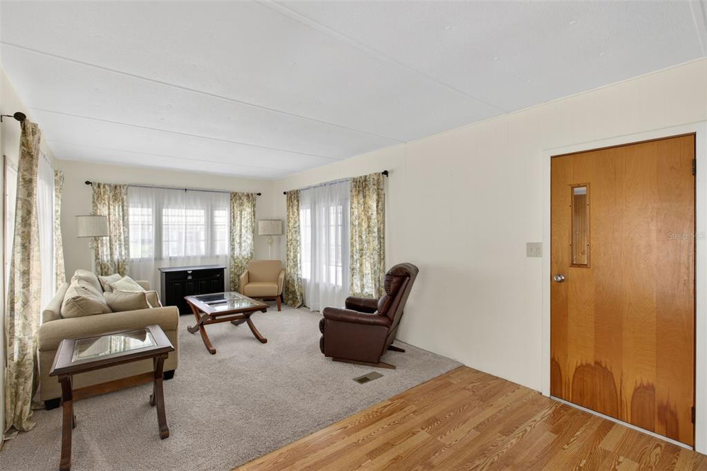 802 Turf Street Venice, FL 34285 - Photo 18 of 50 a living room with furniture and wooden floor